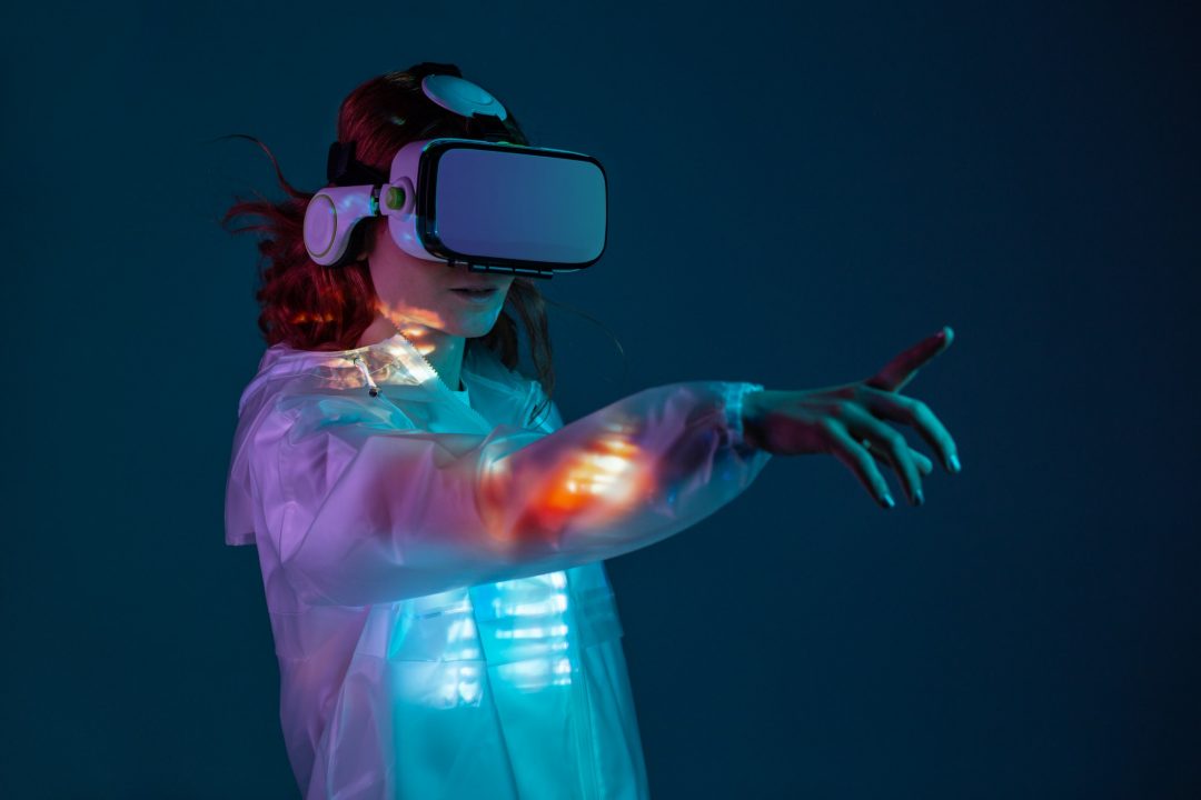 woman touching air in vr glasses.jpg